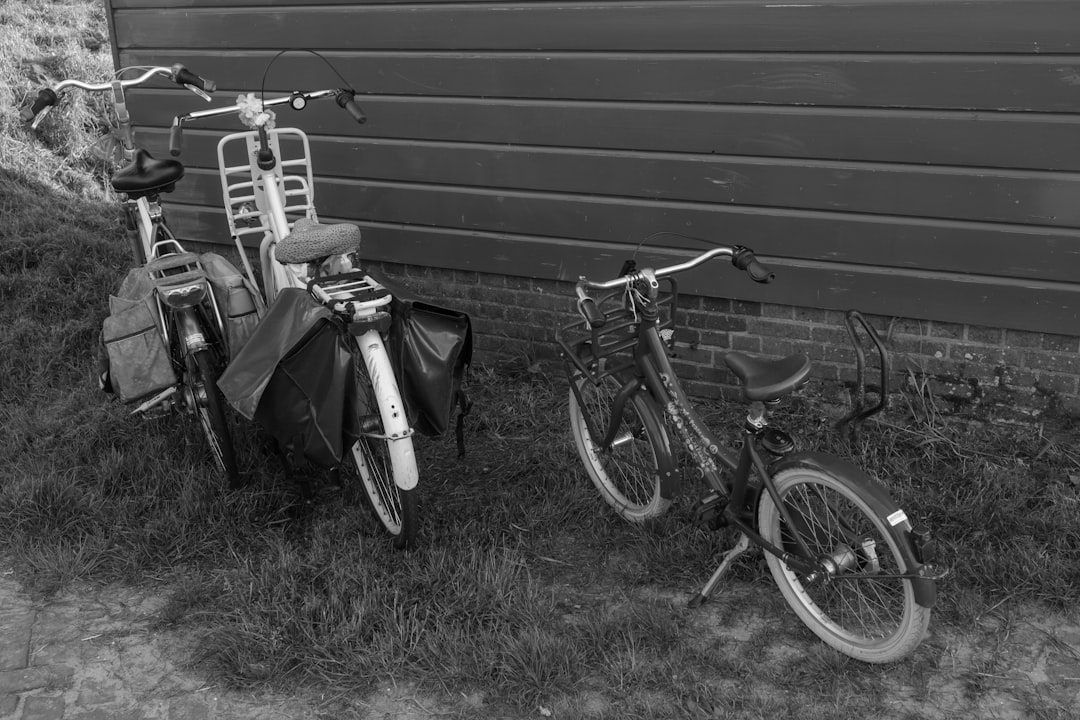 a couple of bikes parked next to a building
