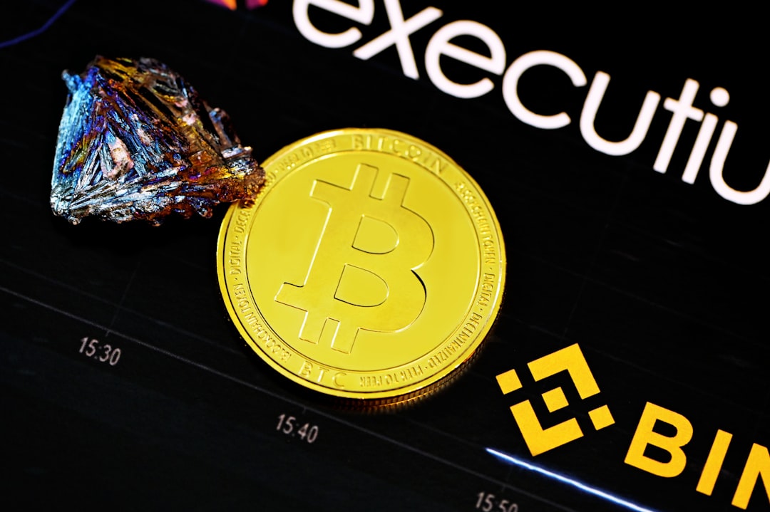 gold round coin on black surface