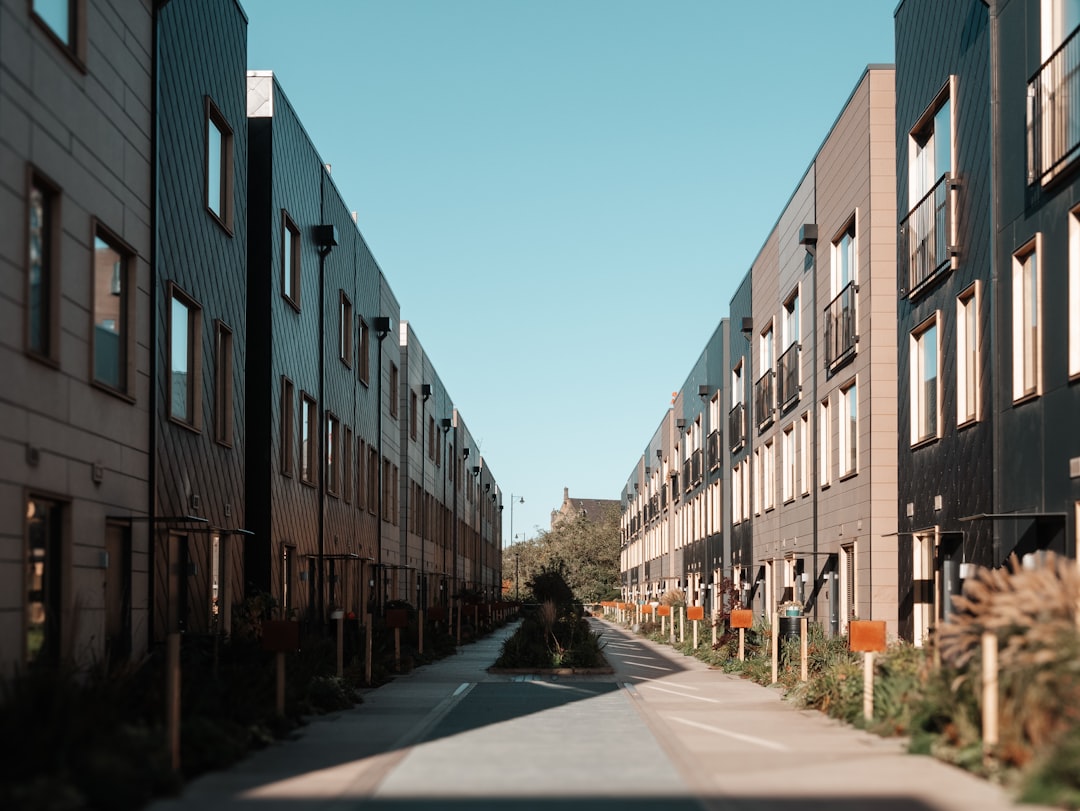a street lined with tall buildings next to each other