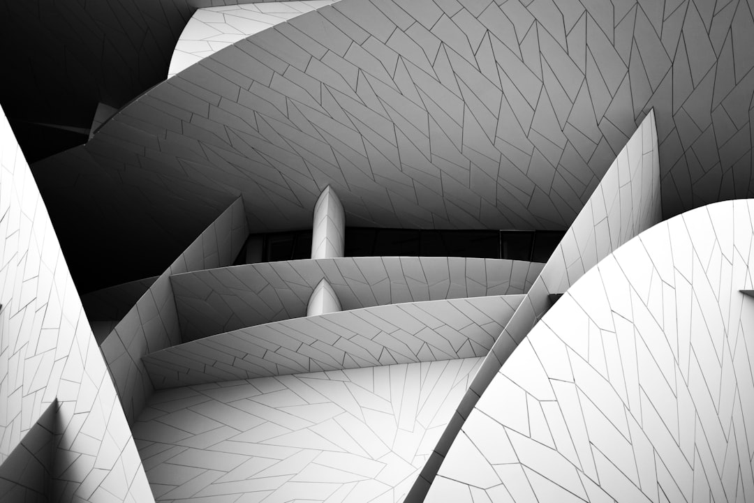 gray scale photo of spiral staircase