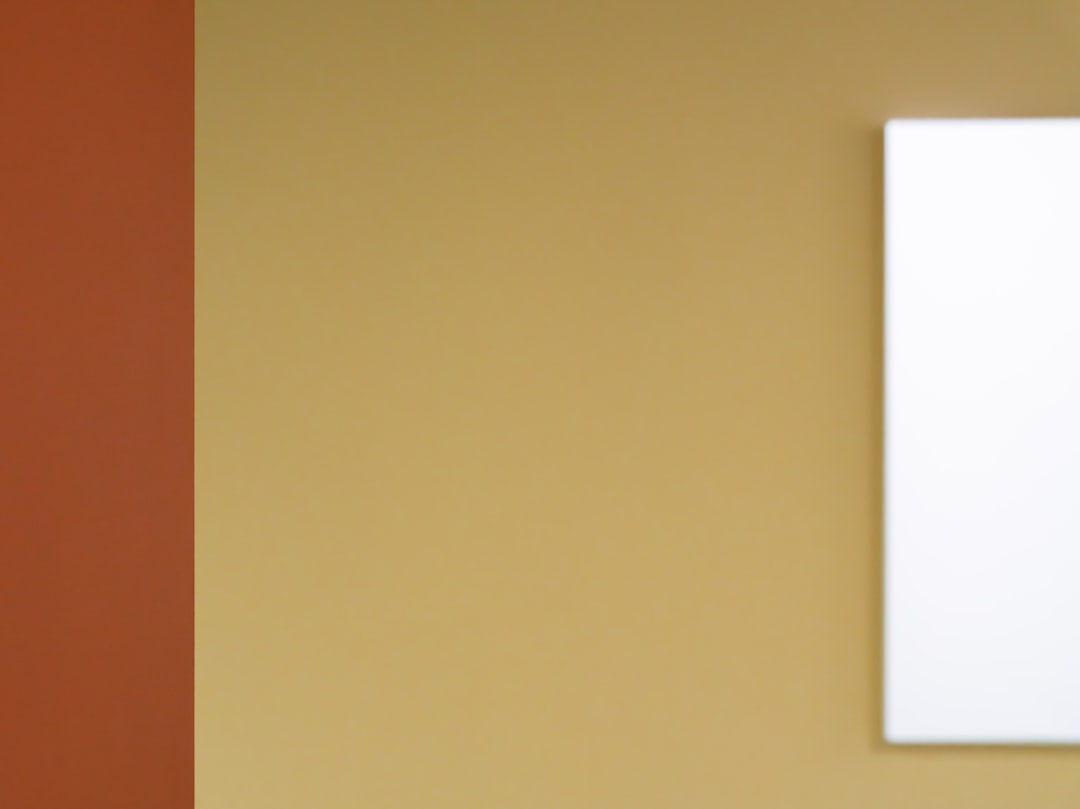 Dual-colored wall with blank white canvas