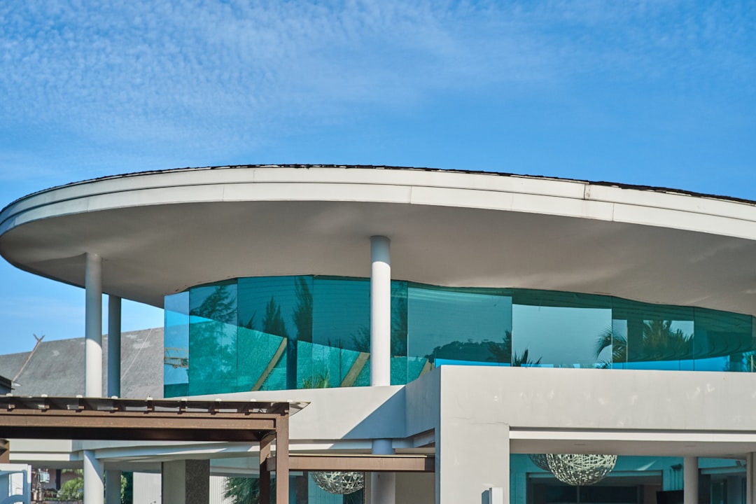 white and green concrete building under blue sky during daytime